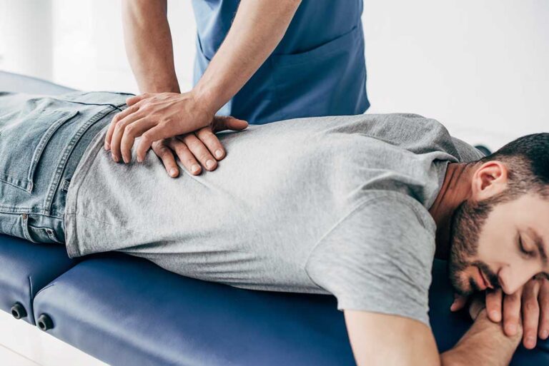 Adult performing neck stretches at home with a relaxed and focused expression.